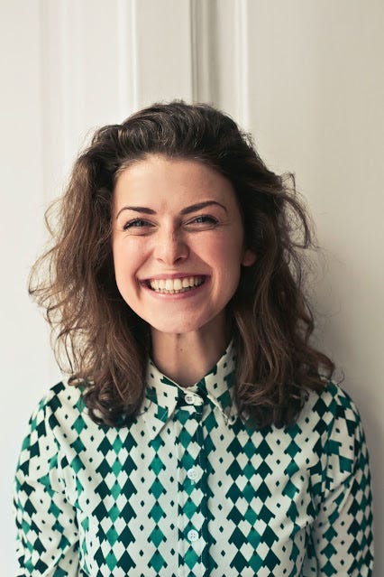 A woman smiling after achieving post-traumatic growth