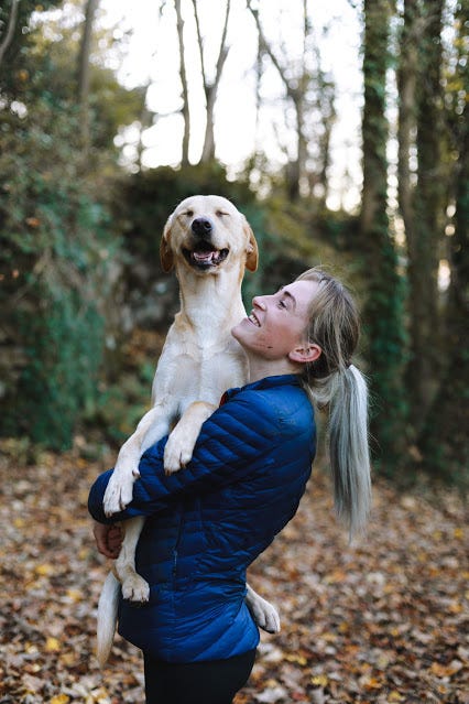 A woman and a dog representing the truth about emotional responses