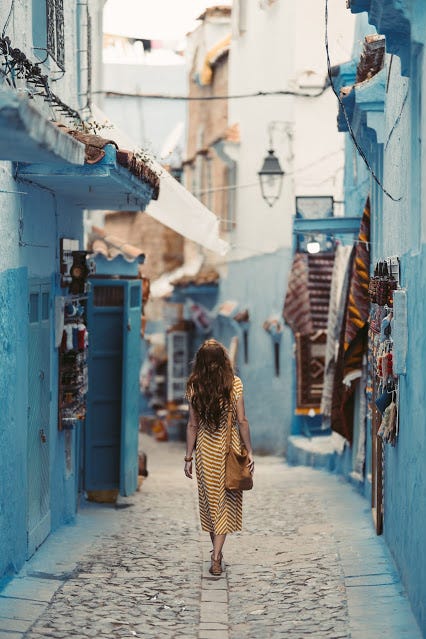 a woman walking a path to explore