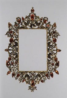 Gilded and enameled frame with elaborate curves