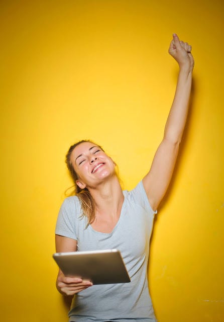 A girl expressing happiness and excitement as an emotional response