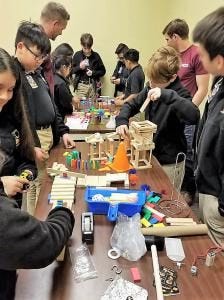 Dr. Freda Deskin with students building crafts