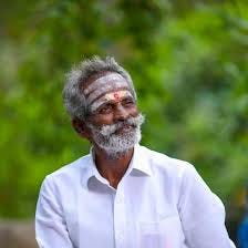 What the white suit and bow tie is to Colonel Sanders, the famous white moustache is to Daddy Arugumgam.