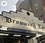 The white brick and historic looking storefront of Brow or eye Lane beer store in Greenpoint Brooklyn