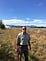 Jarod stands in dry fields in his USFWS uniform