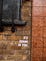 The words “It’s Gonna Be Fine” glued on a brick wall