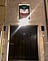 The Italian Flag Hanging Above An Apartment Door in Bologna, Italy. March 2020.