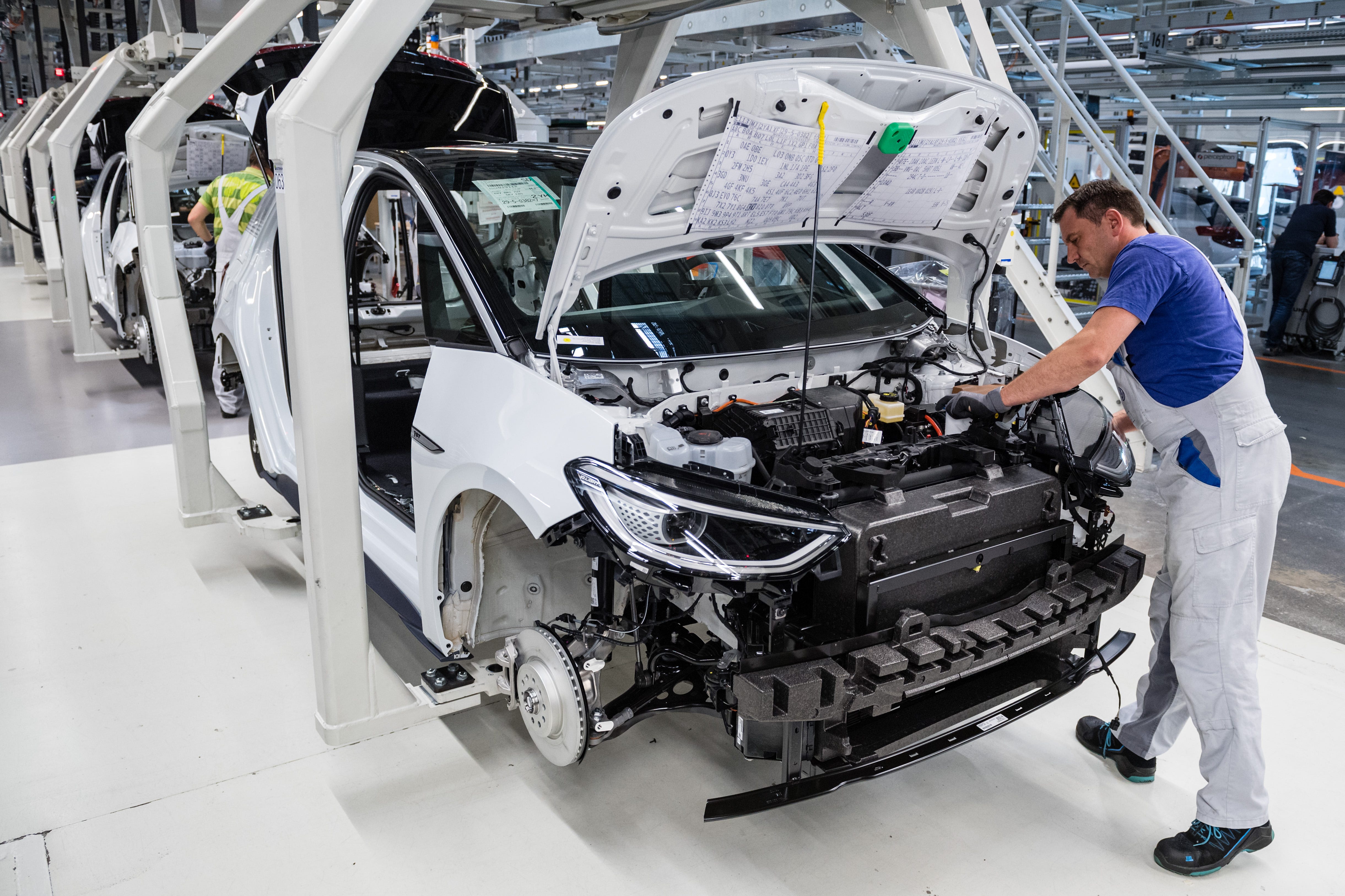 A worker assembles one of Volkswagen's ID.3 electric cars at their factory in Zwickau, Germany on July 31, 2020.