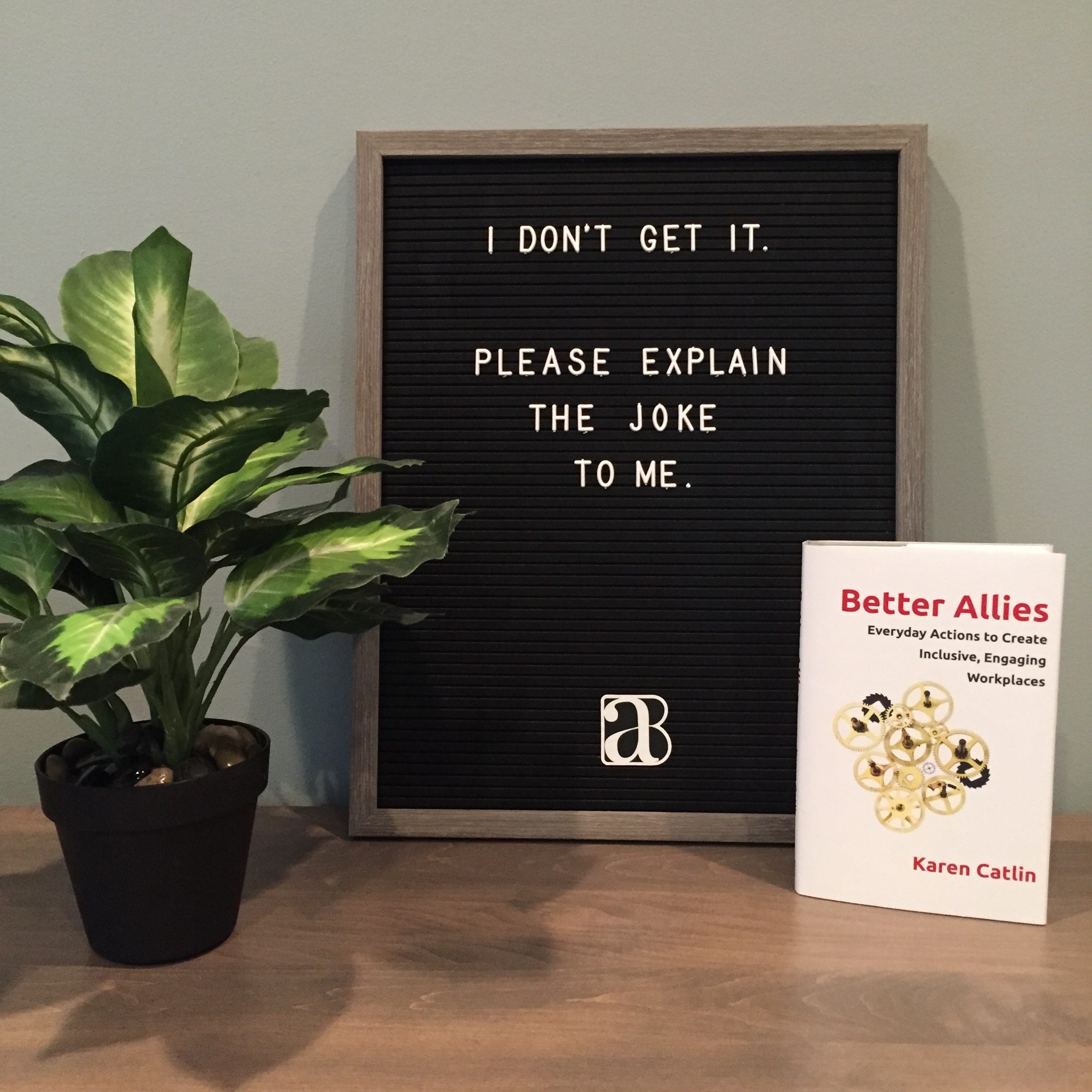 message board with I don’t get it. Please explain the joke to me. With a copy of the Better Allies book by Karen Catlin