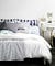 Bed With Blue And White Linens