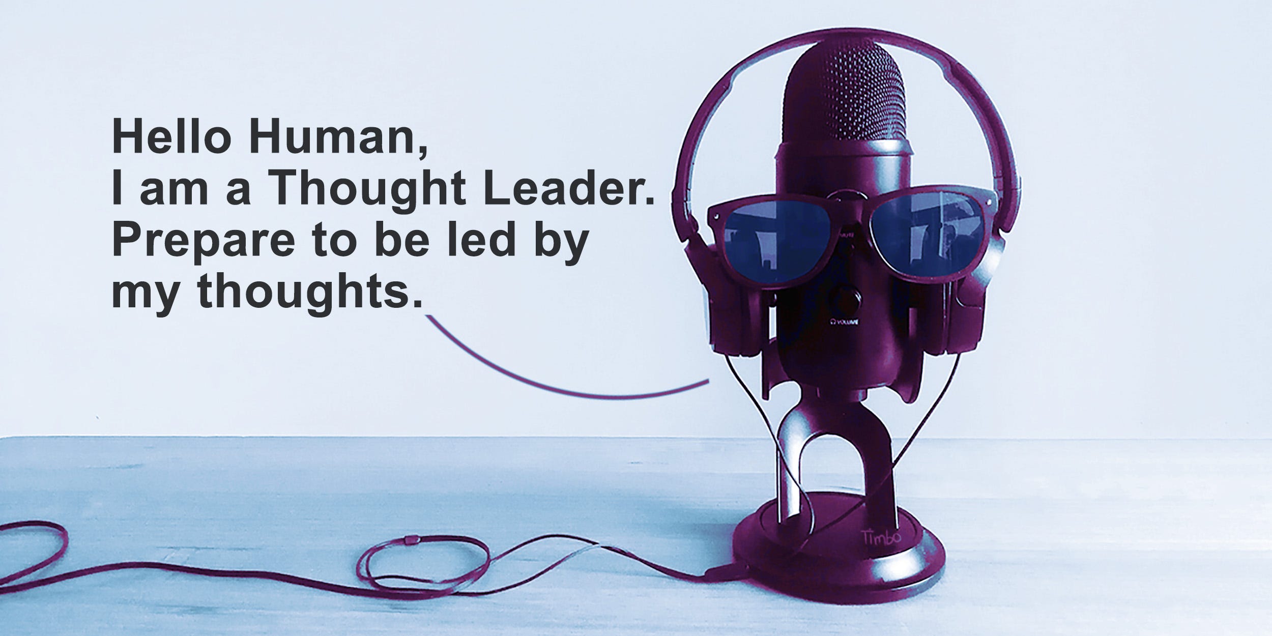 Pic of Tim Horan’s podcast microphone ‘wearing’ sunglasses and saying: “Hello Human. I am a Thought Leader. Prepare to be led by my thoughts.”