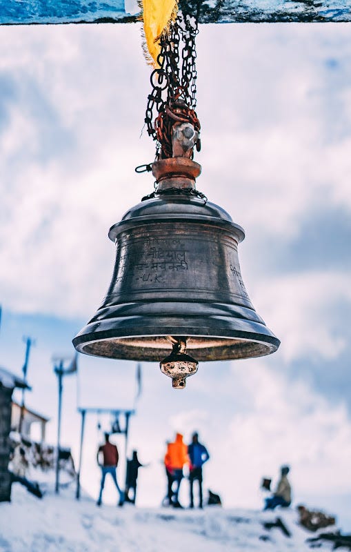 A bell denoting the divinity of God