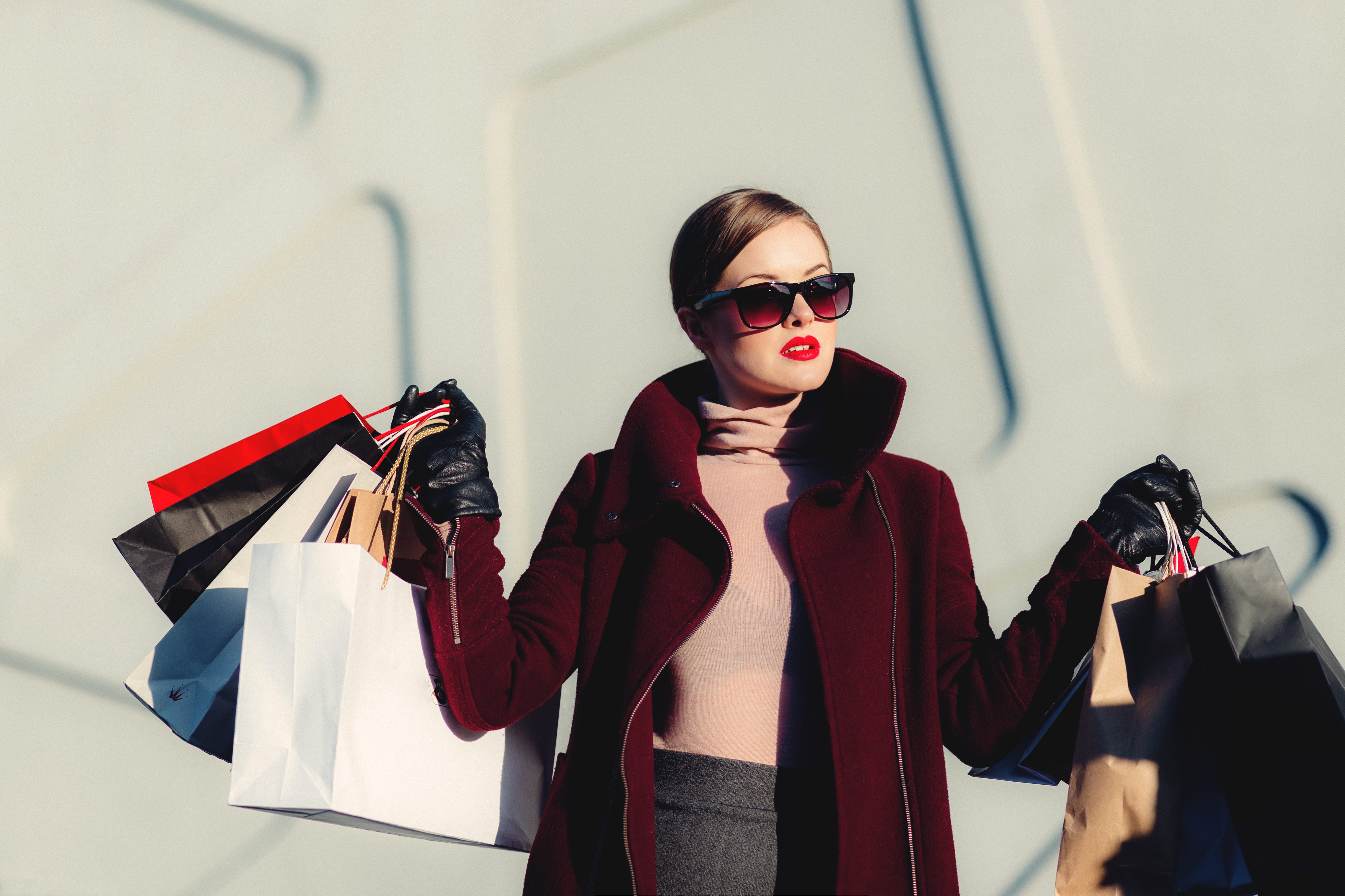 High class woman carrying shopping bags for the amazon personal shopper program.