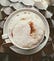 View from above of a cappuccino with lots of froth.