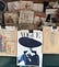 An antique magazine shop with a cover of Vogue on front on a wooden desk