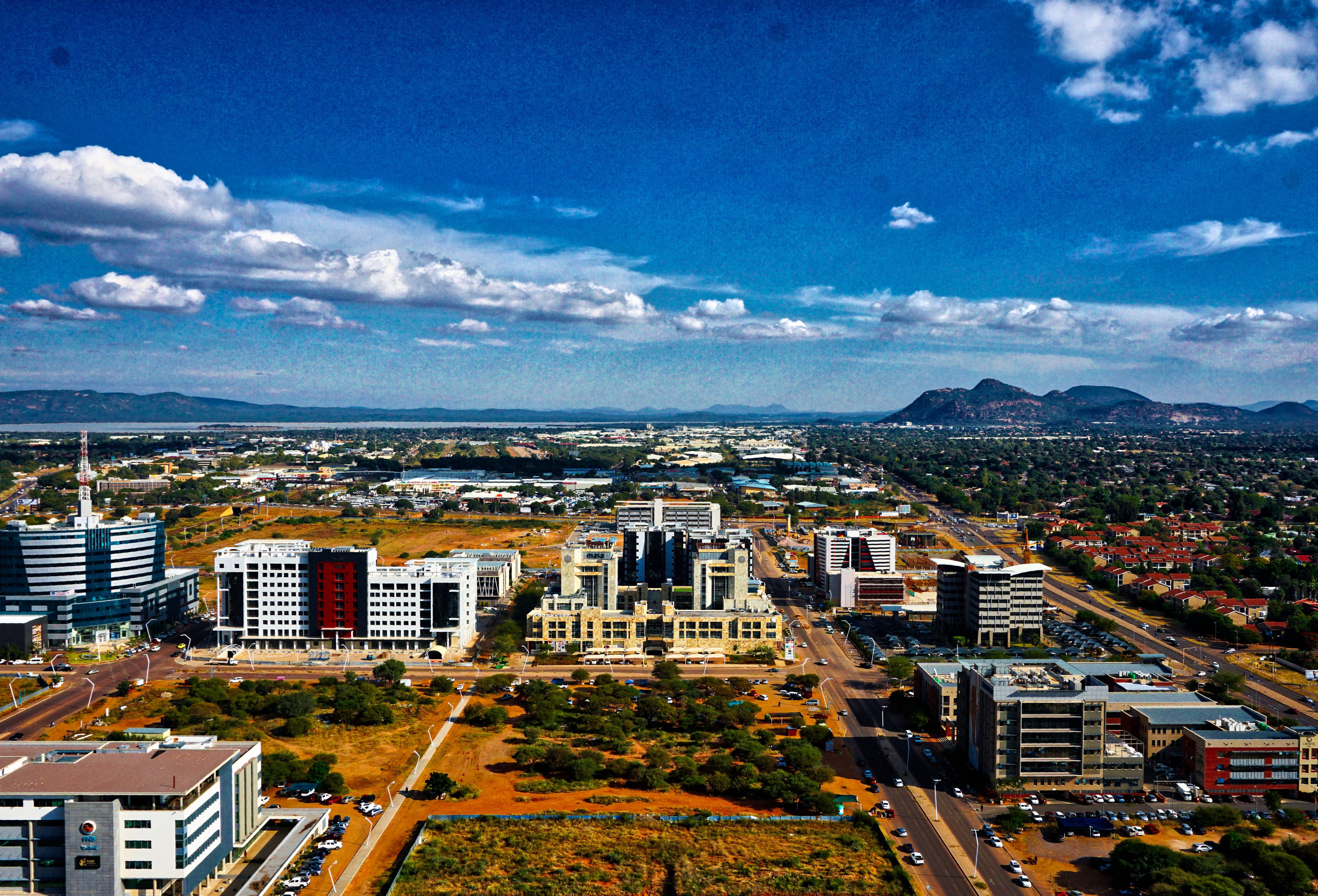 Aerial view of Gaborone, Botswana, showcasing modern architecture and surrounding natural landscapes.