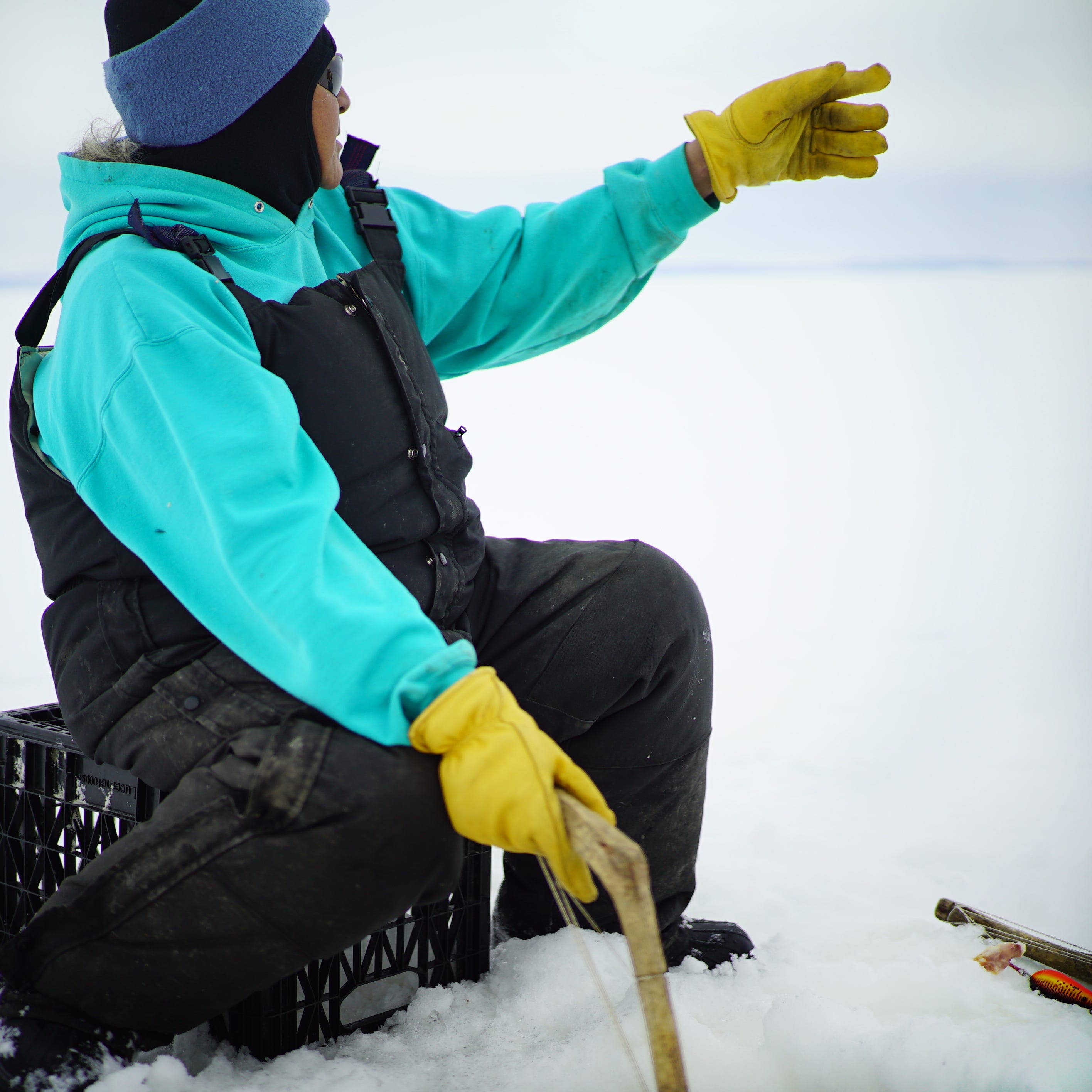 a fisherwoman from Selawik ice fishing on Selawik Lake