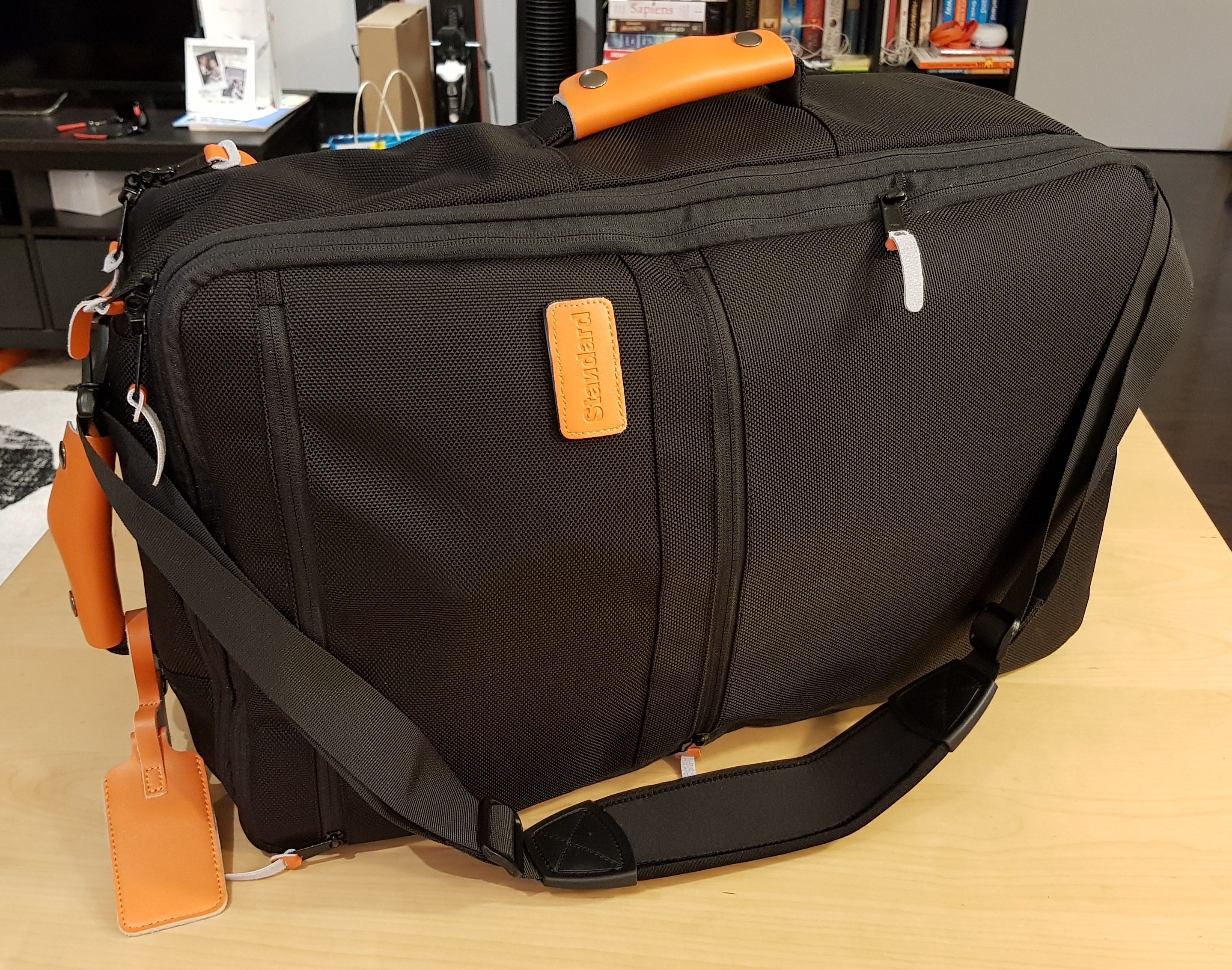 hand luggage with wheels and shoulder straps