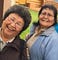 Photo of Cora Demit, Upper Tanana Athabascan, and Sylvia Pitka, Upper Tanana Athabascan, standing together.