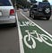 A painted on-road bike lane with the text ’LAME’ instead of lane.