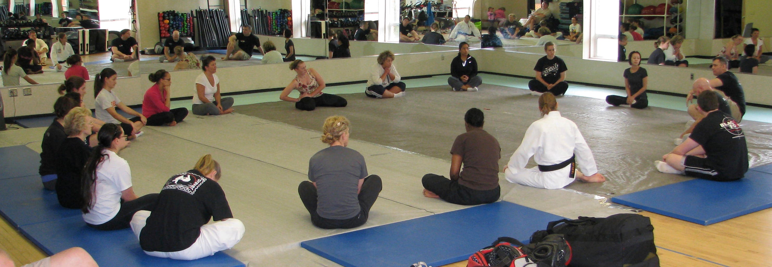 BJJ students performing stretching exercises