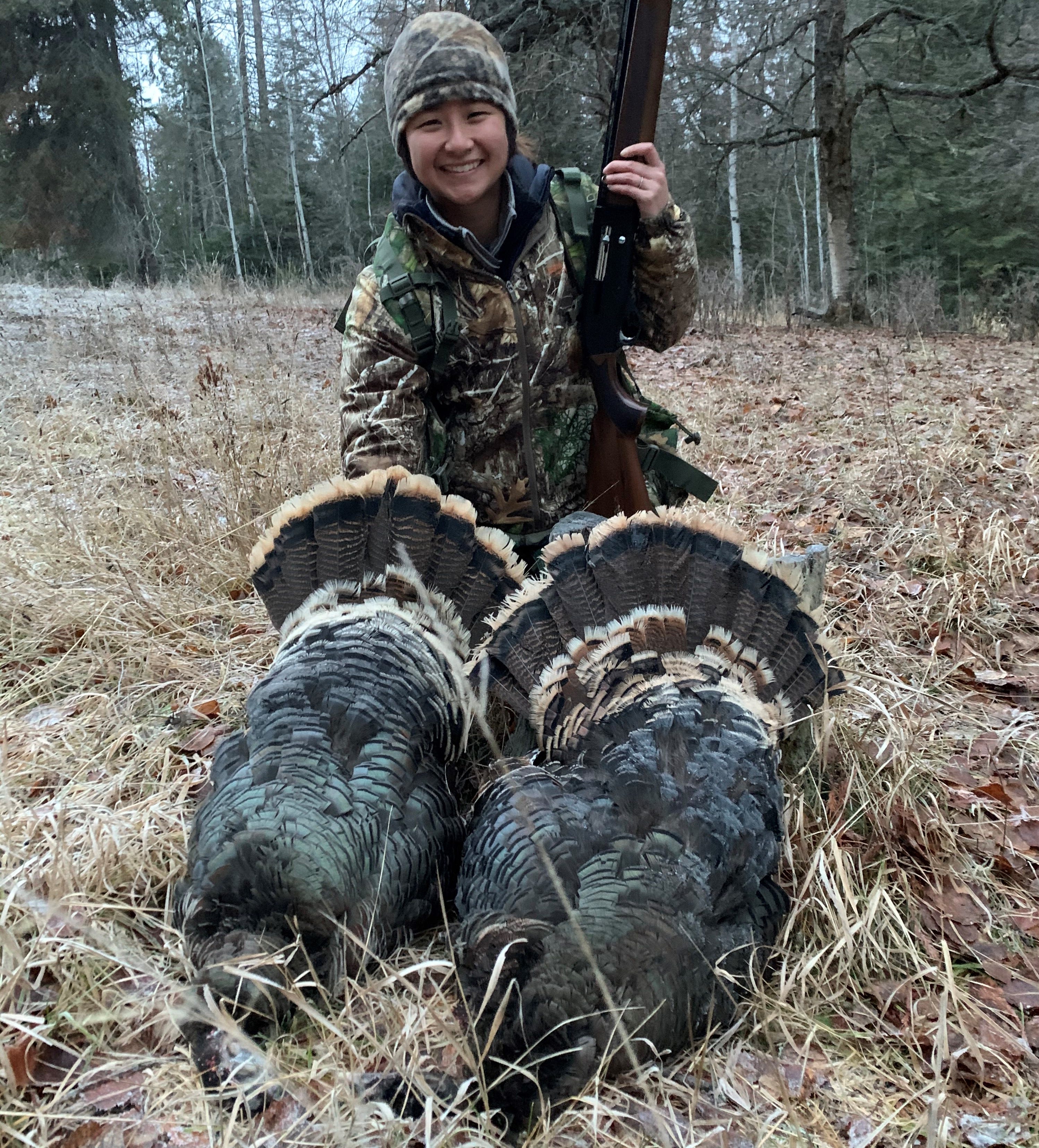 LiLi Wong is pictured with two turkeys she harvested on a WDFW mentored hunt.