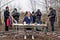 Christoph Niemann sits at a drawing desk in a Berlin park with a film crew setting up behind him.