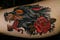 Wolf und Rosen Tattoo