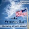 American flag on a wooden pole waving in a lightly clouded sky with the words “Veterans Day Honoring all who served” and logo