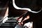 Hand playing piano keys.