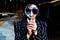A person with a magnifier on her face