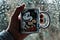 Hand holding Mickey Mouse mug against a snowy background. Do rats freak you out?