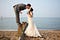 wedding regrets - bride and groom on british seaside beach