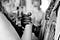 Man and woman facing each other holding clasped hands between them.