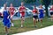Luke Brenneman photographed running amongst several competitors and his own team mates. He is clearly much smaller in size.