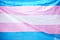 Image of a transgender flag of blue, pink, and white stripes