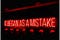 Red neon sign saying, “IT BEGAN AS A MISTAKE.”
