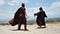 Two people duel on a hilltop