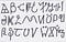 Black sharpie pen written on white thin postcard, running through the alphabet from A in the top left, to Z bottom right.