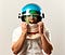 Man wearing a white button down shirt and a space helmet. The visor is open and his face looks surprised.
