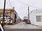 lateral view of Mateo Street in Los Angeles, gray sky, graffiti-covered buildings and dumpster