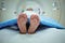 feet poke out of MRI machine