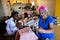 Curtisha Bell and her aunt Vicky Blake show progress of their festive surgical masks to friends and family on video chat.