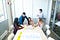 A group of Fung Fellows gathers around a laptop on a table; a poster on the table says “#Fungfellows”.