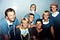 Bill and Kathy Magee pose in scrubs with their five children during a medical mission.