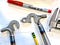 Two bicycle dropouts welded into metal tubes on a workbench