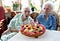 Marie (L) and Gabrielle (R) Vaudremer, 101-year-old Belgian twins, celebrate their birthday at their retirement home in 2011.