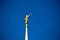 Gold Moroni statue on top of spire