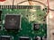 Close up of the Macintosh Classic logic board showing damage.