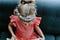 Little girl in a princess tiara reading a book